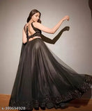 Black velvet lehenga Choli with net bottom and dupatta, embellished top on display stand
