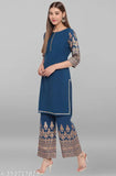 Teal poly crepe printed kurti and palazzos with three-quarter sleeves - Indian women's fashion in teal