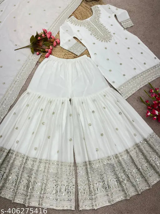 White bridal lehenga with embroidered borders, gold accents, 6-panel design