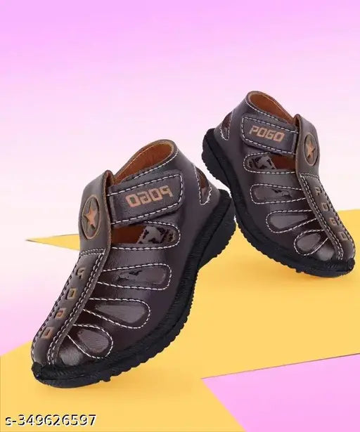 Black strap sandals with velcro closure, designed for kids, suitable for both boys and girls