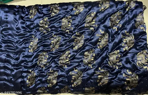 Gold embroidered Jaipuri silk quilt in a rolled state