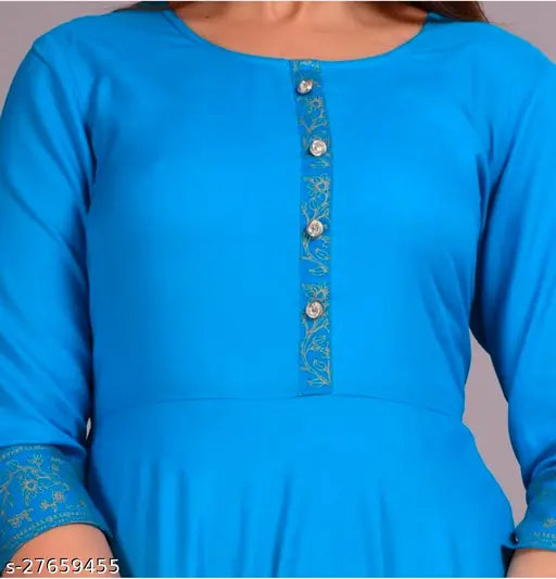 The image showcases a vibrant blue kurta with a gold border print design. It features short sleeves and is displayed on a mannequin