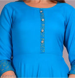 The image showcases a vibrant blue kurta with a gold border print design. It features short sleeves and is displayed on a mannequin