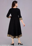 Women's long flared black kurta with embellished borders and side pockets