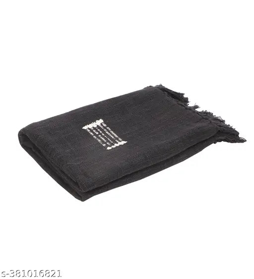 A black cotton throw blanket with a pattern, measuring 50 x 60 inches