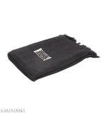 A black cotton throw blanket with a pattern, measuring 50 x 60 inches