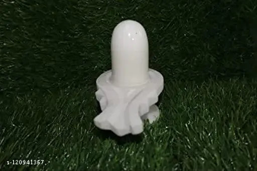 White marble Shivling, perfect for Pooja Mandir. Authentic Indian origin, 12 cm length, 3 cm height, and 8 cm breadth. Ideal for home, shop, factory, or office worship