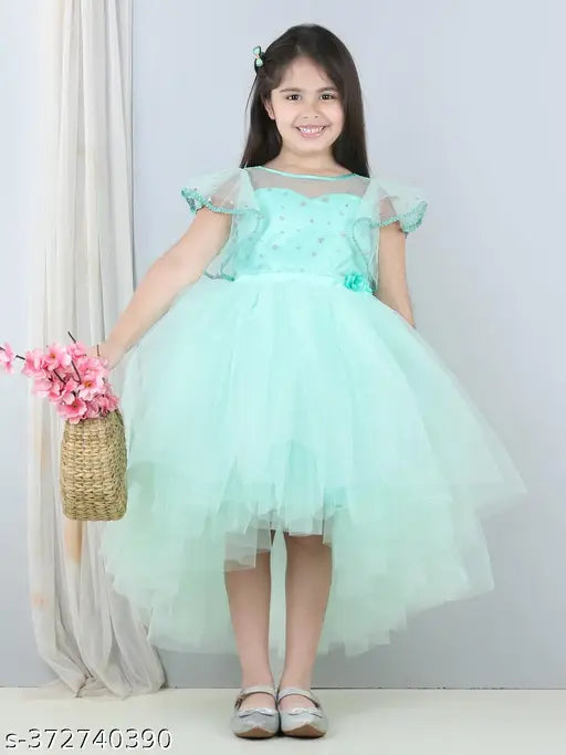 Sea green net party dress for kids, embellished with toy balloons, suitable for low girls' wear (1-2 years, 23'' bust & 48'' length; 2-3 years, 25'' bust & 54'' length; 3-4 years, 26'' bust & 60'' length; 6-7 years, 33'' bust & 66'' length). Made in India