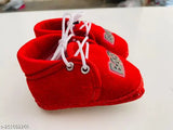Soft canvas new born baby booties for boy and girl, featuring cartoon faces. Perfect for keeping feet warm and protected in any season. Available in sizes: 3-6 months, 6-9 months, 9-12 months. Made in India