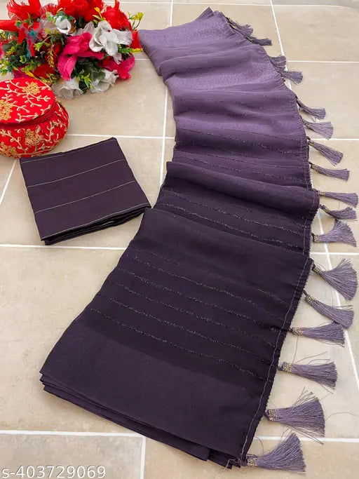 The image is of a brocade sari with intricate patterns, laid out flat on a surface