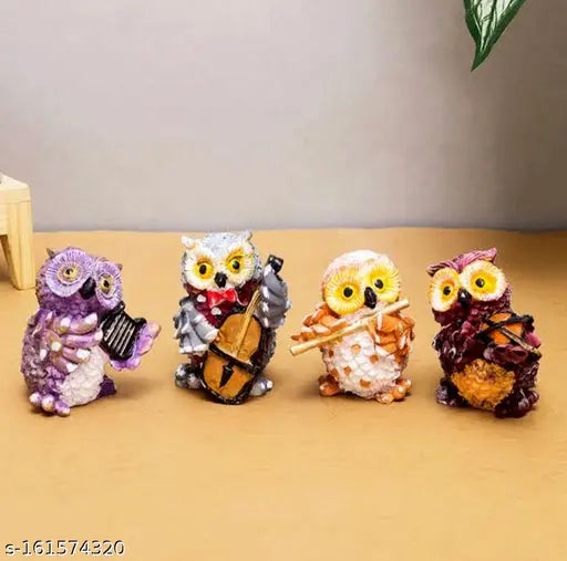 Poly Resin orchestra owl set, playing musical instruments: guitar, violin, flute, accordion. Unique home decor accessories, hand-painted with vivid colors. Handcrafted for durability and stability, perfect for living room, bedroom, office, temple, or garden. Indian-made, eye-catching housewarming gift