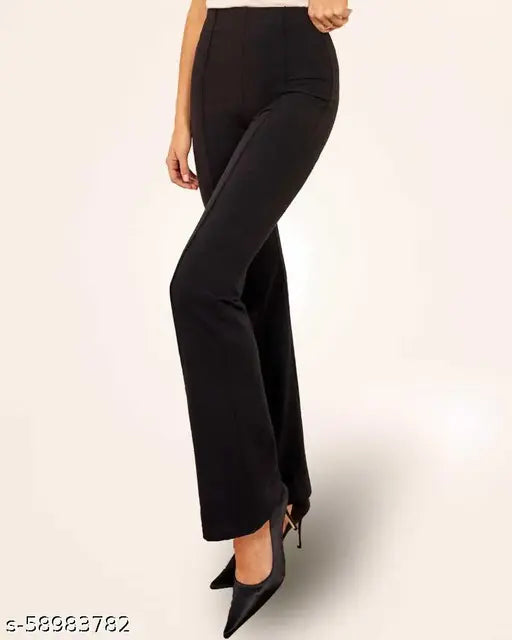 The image shows a pair of black, high-waisted pants with a slim fit and straight legs