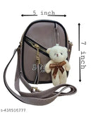 Purse with stuffed animal, brown shoulder bag