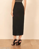 Cotton blend black pencil skirt, solid silhouette with center front slit. Ankle length, perfect for a chic look with crop tops and strappy heels. Model size 28 (waist 28in, length 66in, hip 38in). Made in India