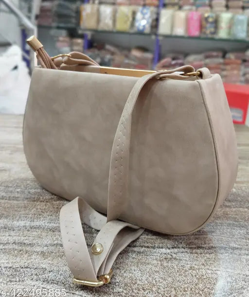 Tan leather slingbag with shoulder strap