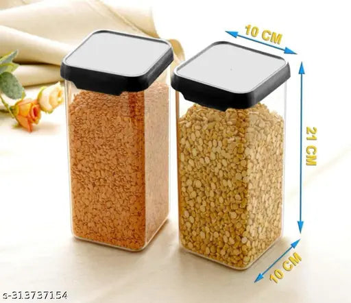 Large clear plastic containers with black lids, each containing food items, displayed in a set of four on a table, labeled 10cm x 10cm