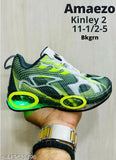 Sports shoe, Kinley 2, BLKGRN with neon yellow detailing and circular cutouts