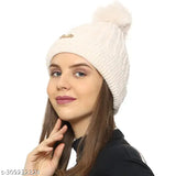 A woman's woolen pom-pom beanie cap