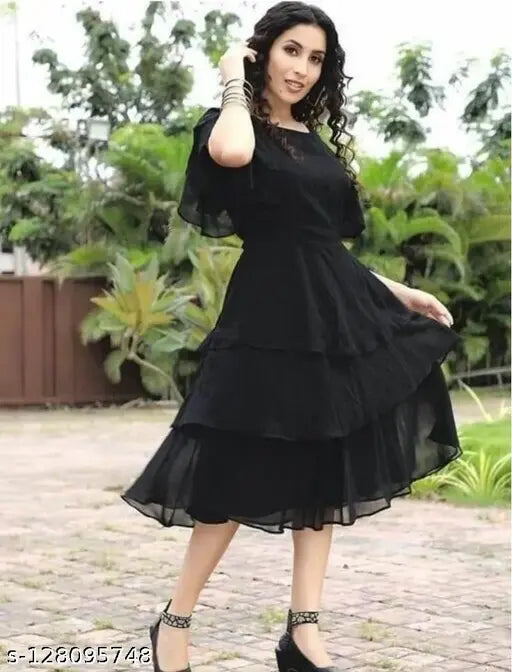 Black ruffled georgette dress, short sleeves, cinched waist, knee-length skirt