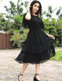 Black ruffled georgette dress, short sleeves, cinched waist, knee-length skirt