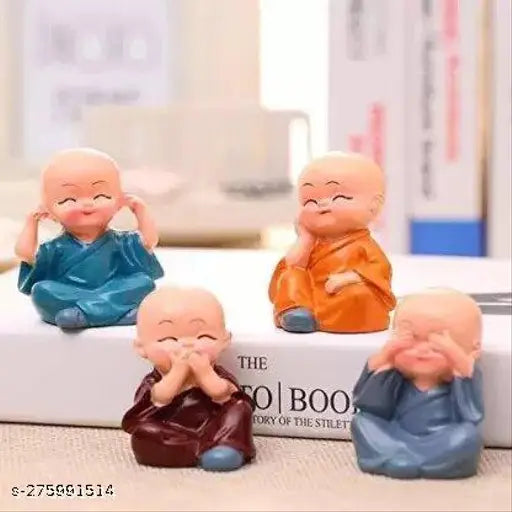Polyresin figurine set of 4, depicting baby monks with various expressions and poses, in vibrant colors. Multiple seated positions, each with distinct facial features