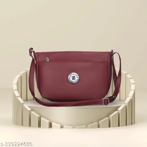 Maroon women's sling bag, adjustable strap, two pockets