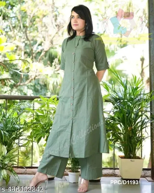 Green cotton A-line kurta set with striped design, three-quarter sleeves, calf length, paired with coordinating green palazzos for daily wear