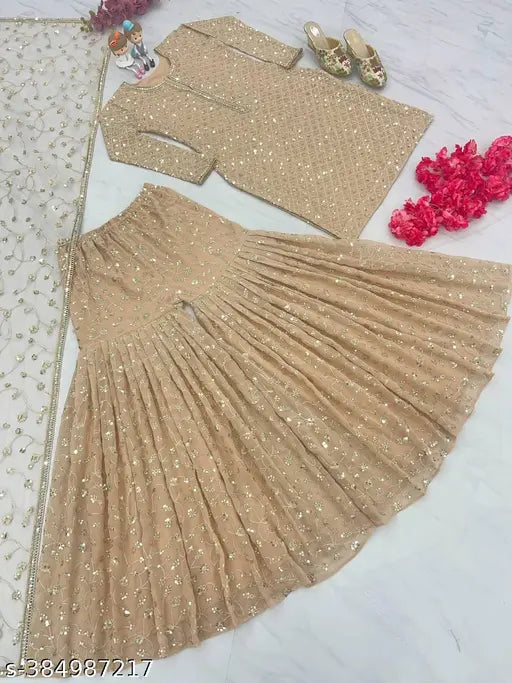 Beige satin dupatta set with matching embellished top and choli, paired with accessories in the background