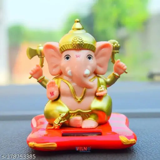 White and red solar-powered hand shaking Ganesha statue, perfect for car dashboard or office decor. Elegant design, unique finish, and lightweight. Ideal spiritual lucky gift, suitable for business success and good fortune. Made in India