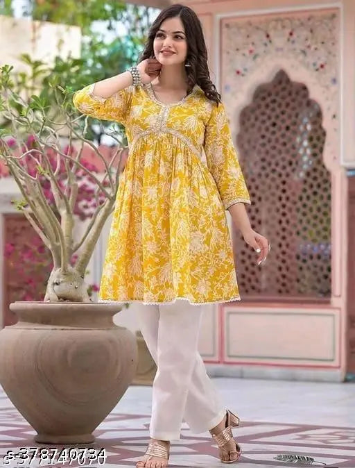 Yellow rayon printed kurti with three-quarter sleeves, perfect for summer office wear and casual gatherings. Available in sizes L to XXXL, made in India
