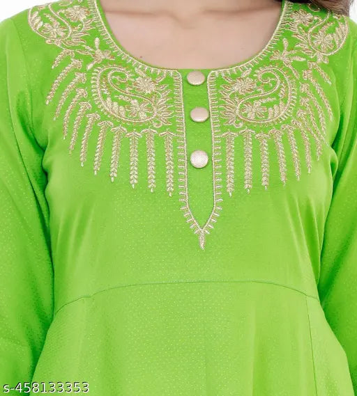 Green long-sleeved tunic, embroidered with intricate designs and patterns