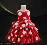 Red and white polka dot dress with ruffled hem, girls' party wear, long-sleeved design, likely for a special occasion or event