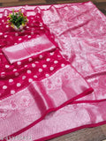 A saree with a pink base and floral embroidery patterns