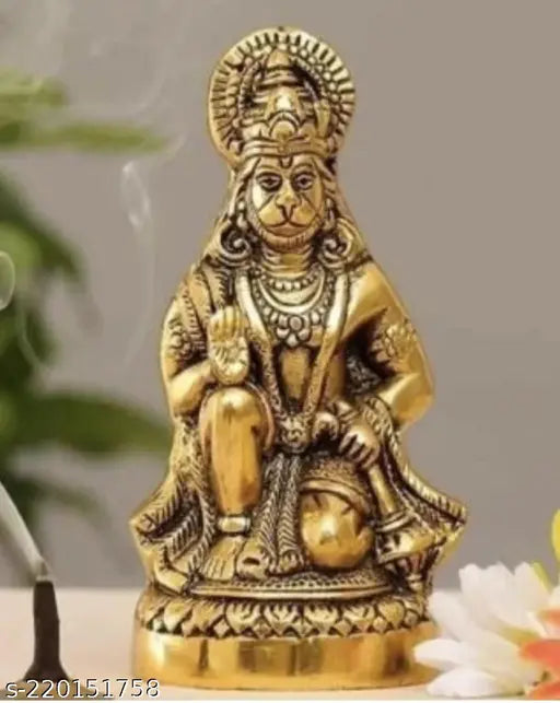 Golden metal statue of Lord Hanuman sitting