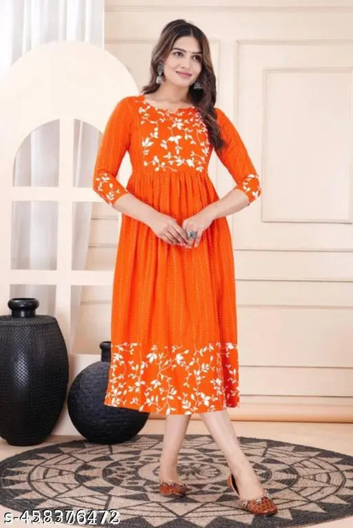 Orange rayon three-quarter sleeve top, single solid color for women, India-made fashion apparel