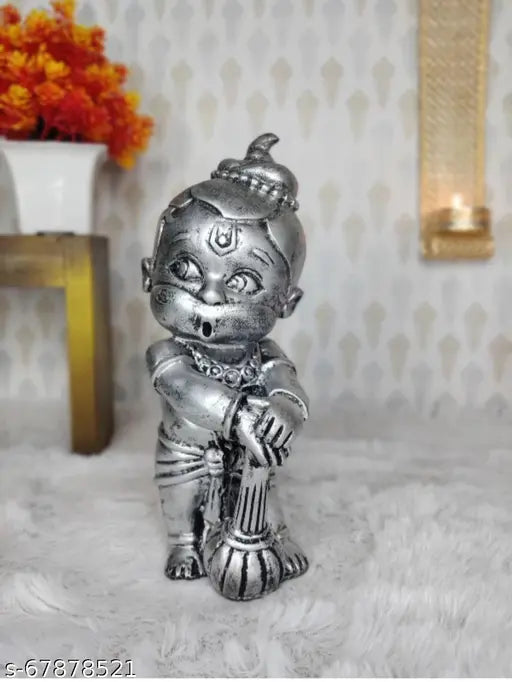 Shiny metal figurine of Hanuman, intricately designed, ideal for decoration or as a vastu-compliant gift, likely made of brass or similar material