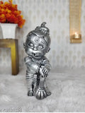 Shiny metal figurine of Hanuman, intricately designed, ideal for decoration or as a vastu-compliant gift, likely made of brass or similar material