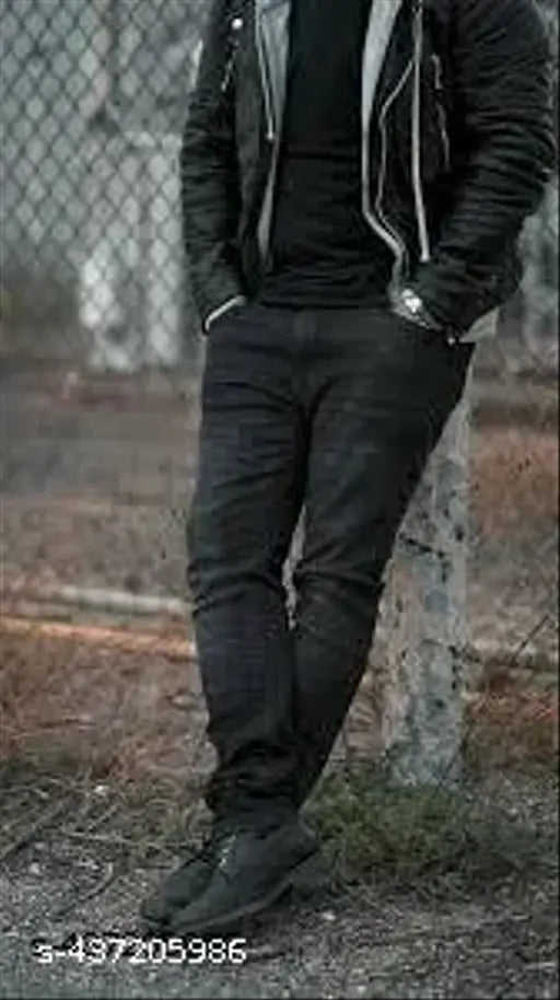 Black denim jeans with a white graphic on the left leg
