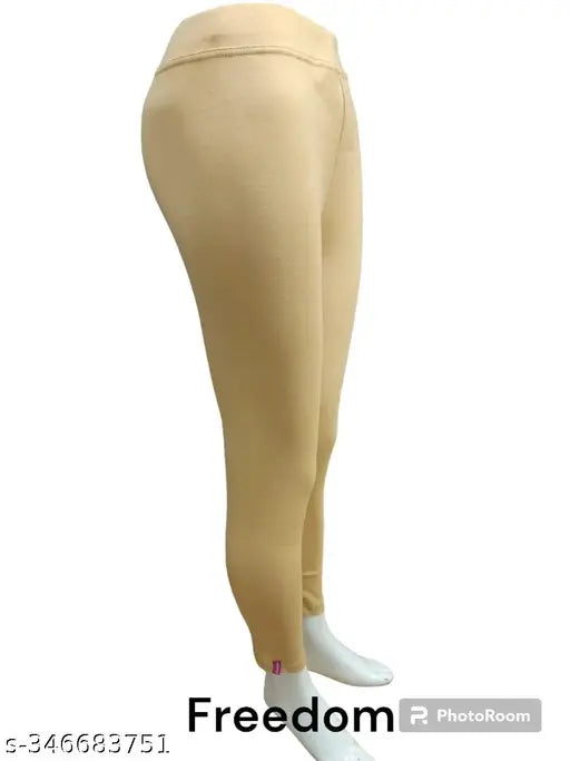 Lycra freedom plain jeggings for ladies, solid-colored ankle fit pants suitable for sports, gym, yoga, or casual wear. Made in India." (125 characters)