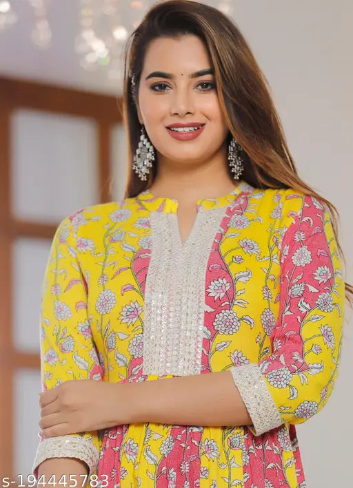 Yellow rayon kurti gown, printed combo for parties and festivals. Close-up of stylish Indian women's wear