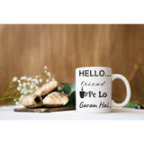Ceramic coffee mug with 'hello. friend pe lo garam chai' printed in English