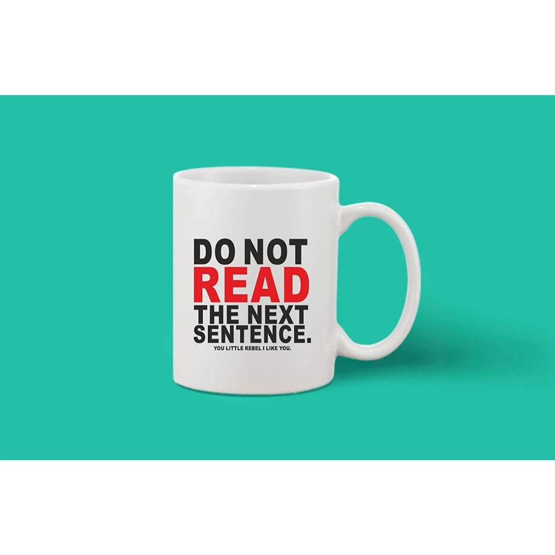 White ceramic coffee mug with quote, "Do not read the next sentence