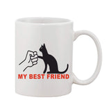 White ceramic coffee mug with printed black cat text featuring 'My Best Friend' inscription