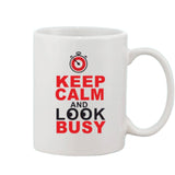 Printed coffee mug with red and white design, saying 'keep calm and look busy