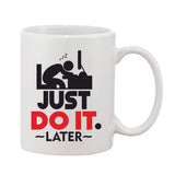 Ceramic coffee mug with white interior, printed with humorous motivational message and black design on white surface