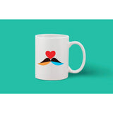 A white ceramic coffee mug with a heart design on it and an included handle