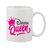 Ceramic coffee mug with white background and pink 'Drama Queen' text, featuring a crown symbol and a Disney logo